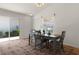 Dining room with gray table and chairs, view to the living room at 1387 Zest Ave, The Villages, FL 32163