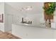 Clean kitchen features light wood cabinets and a breakfast bar at 1387 Zest Ave, The Villages, FL 32163