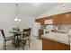 Well-equipped kitchen with ample counter space and a breakfast nook at 1387 Zest Ave, The Villages, FL 32163