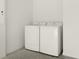 Interior laundry room with side-by-side washer and dryer at 1387 Zest Ave, The Villages, FL 32163