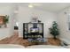 Living room with built-in shelving, large TV, and a cozy seating area at 1387 Zest Ave, The Villages, FL 32163