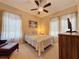 Cozy bedroom with a ceiling fan and ample natural light at 172 Crepe Myrtle Dr, Groveland, FL 34736