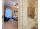 Well-lit bedroom with ensuite bathroom, featuring bathtub and shower at 172 Crepe Myrtle Dr, Groveland, FL 34736