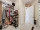 Well-organized walk-in closet with shoe storage at 172 Crepe Myrtle Dr, Groveland, FL 34736