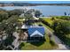 Blue house with metal roof, spacious yard, lake view at 17531 County Road 455, Montverde, FL 34756