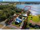 Aerial view of a lakefront home with a large yard and private dock at 17531 County Road 455, Montverde, FL 34756