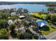 Property overview with lake and outbuildings at 17531 County Road 455, Montverde, FL 34756