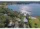 Aerial view showcasing a lakefront property's location and surrounding landscape at 17531 County Road 455, Montverde, FL 34756