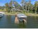 Aerial view of house and boathouse on the lake at 17531 County Road 455, Montverde, FL 34756