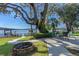 Backyard patio with fire pit and lake view at 17531 County Road 455, Montverde, FL 34756