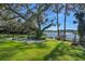 Landscaped backyard with lake view at 17531 County Road 455, Montverde, FL 34756