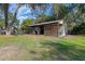 Exterior view of a barn with metal roof and wooden siding at 17531 County Road 455, Montverde, FL 34756