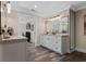 Bathroom with double vanity and large mirror at 17531 County Road 455, Montverde, FL 34756