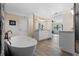 Spa-like bathroom with soaking tub and walk-in shower at 17531 County Road 455, Montverde, FL 34756