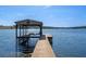 Lakefront property with a covered boat dock and spacious deck at 17531 County Road 455, Montverde, FL 34756