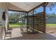 Covered outdoor area with a chicken coop and fenced yard at 17531 County Road 455, Montverde, FL 34756