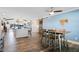 Bright dining area with a wooden table and chairs, view to kitchen at 17531 County Road 455, Montverde, FL 34756