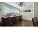 Home office with a long desk, two chairs, and a large window at 17531 County Road 455, Montverde, FL 34756