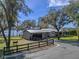 Lakefront home with a metal roof, large yard, and donkey at 17531 County Road 455, Montverde, FL 34756