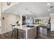 Modern kitchen with a large island, stainless steel appliances, and white cabinetry at 17531 County Road 455, Montverde, FL 34756