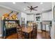Modern kitchen with white cabinets, stainless steel appliances, and an eat-in area at 17531 County Road 455, Montverde, FL 34756