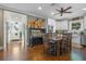 Open concept kitchen features an island, white cabinets, and dark wood floors at 17531 County Road 455, Montverde, FL 34756