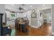 Charming eat-in kitchen with farmhouse sink, white cabinets, and wooden table at 17531 County Road 455, Montverde, FL 34756