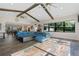 Living room with hardwood floors, exposed beams, and an open floor plan at 17531 County Road 455, Montverde, FL 34756