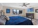 Main bedroom with a king-size bed and lake view at 17531 County Road 455, Montverde, FL 34756