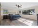 Spacious main bedroom with large window and lake view at 17531 County Road 455, Montverde, FL 34756