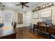 Spacious office with wood floors, barn door, and two desks at 17531 County Road 455, Montverde, FL 34756