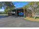 Large covered parking area with multiple parking spaces and room for large vehicles and equipment at 17531 County Road 455, Montverde, FL 34756