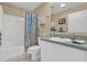 Guest bathroom with tub shower and updated vanity at 202 Estrada Pl, The Villages, FL 32159