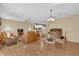 Spacious living room with leather sofas and wood flooring at 202 Estrada Pl, The Villages, FL 32159