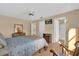 Main bedroom with ceiling fan, ensuite bathroom, and ample closet space at 202 Estrada Pl, The Villages, FL 32159
