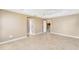 Spacious bedroom with tile flooring and access to bathroom at 2131 Baldwin Run, The Villages, FL 32162