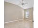 Spacious bedroom with ceiling fan and large window at 2131 Baldwin Run, The Villages, FL 32162