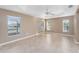 Bright and airy bedroom with tile flooring and ceiling fan at 2131 Baldwin Run, The Villages, FL 32162