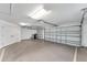 Spacious two-car garage with ample storage space at 2131 Baldwin Run, The Villages, FL 32162