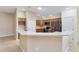Modern kitchen with stainless steel appliances and granite countertops at 2131 Baldwin Run, The Villages, FL 32162