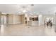 Open kitchen with breakfast bar, stainless steel appliances, and ample cabinetry at 2131 Baldwin Run, The Villages, FL 32162