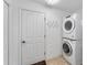 Laundry room with washer, dryer, and storage at 2131 Baldwin Run, The Villages, FL 32162