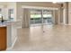 Spacious living area with tile floors and access to outdoor space at 2131 Baldwin Run, The Villages, FL 32162