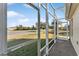 Screened porch with view of the neighborhood at 2131 Baldwin Run, The Villages, FL 32162
