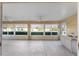 Bright sunroom with outdoor kitchen and view at 2131 Baldwin Run, The Villages, FL 32162