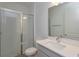 Bathroom with shower, vanity, and mirror at 2137 Sunshine Peak Dr, Minneola, FL 34715