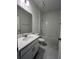 A full bathroom with a shower-tub combo, vanity, toilet, and contemporary finishes at 2137 Sunshine Peak Dr, Minneola, FL 34715