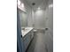 A full bathroom with a shower-tub combo, toilet, vanity, and bright modern fixtures at 2137 Sunshine Peak Dr, Minneola, FL 34715
