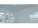 Bright bedroom featuring three arched windows and city view at 2137 Sunshine Peak Dr, Minneola, FL 34715