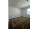 Neutral bedroom with a single window that fills the room with natural light at 2137 Sunshine Peak Dr, Minneola, FL 34715